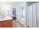 Bright bathroom with a bathtub and shower combination, plus a vanity with a sink at 334 Huckleberry Loop, Mebane, NC 27302