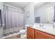 Bright bathroom featuring wood-look floors, a shower and tub combo, and a modern vanity at 334 Huckleberry Loop, Mebane, NC 27302