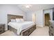 Comfortable bedroom with a king-sized bed, neutral tones, and access to an ensuite bathroom at 334 Huckleberry Loop, Mebane, NC 27302
