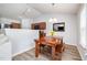 Cozy dining room with rustic wooden table and bench seating, plus modern track lighting above at 334 Huckleberry Loop, Mebane, NC 27302