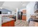 Bright and airy kitchen with stainless steel appliances, ample counter space and view to living area at 334 Huckleberry Loop, Mebane, NC 27302