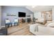 Comfortable living room featuring vaulted ceilings, ample seating, and a cozy fireplace at 334 Huckleberry Loop, Mebane, NC 27302