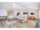 Spacious living area with a large sectional sofa, hardwood floors, and an open layout at 334 Huckleberry Loop, Mebane, NC 27302