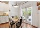 Cozy breakfast nook with table seating near the doors and white cabinets at 3810 Stoneybrook Dr, Durham, NC 27705