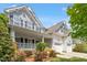 Charming two-story home featuring a welcoming front porch, well-maintained landscaping, and a convenient two-car garage at 3810 Stoneybrook Dr, Durham, NC 27705