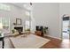 Bright living room boasts high ceilings, a fireplace, and multiple windows for abundant light at 3810 Stoneybrook Dr, Durham, NC 27705