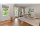 Bright living room boasting hardwood floors, neutral paint, natural light, with elegant decor and a stylish workstation at 3810 Stoneybrook Dr, Durham, NC 27705