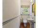 Cozy bathroom with pedestal sink, toilet, and a window with shutter providing natural light at 400 Bowling Creek Rd, Chapel Hill, NC 27514