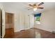 Bedroom with Hardwood Floors, Windows, and View of Built-ins at 400 Bowling Creek Rd, Chapel Hill, NC 27514