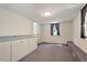 Large bonus room with carpet and storage cabinets and a window at 400 Bowling Creek Rd, Chapel Hill, NC 27514