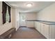 Spacious bonus room featuring carpet, storage cabinets and a window with natural light at 400 Bowling Creek Rd, Chapel Hill, NC 27514