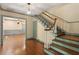 Inviting foyer with hardwood floors and staircase with glimpses of other rooms at 400 Bowling Creek Rd, Chapel Hill, NC 27514