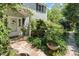 Lovely entrance with stone pathway, beautiful landscaping, and a white front door at 400 Bowling Creek Rd, Chapel Hill, NC 27514