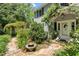 Lovely entrance with stone pathway, beautiful landscaping, and a white front door at 400 Bowling Creek Rd, Chapel Hill, NC 27514