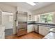 Bright kitchen featuring stainless steel appliances, granite countertops, and a sunlit window at 400 Bowling Creek Rd, Chapel Hill, NC 27514