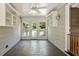Sunny sunroom with tiled floor, beadboard ceiling, and multiple windows to enjoy outdoor views at 400 Bowling Creek Rd, Chapel Hill, NC 27514