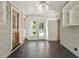 Bright sunroom with tiled floor, ceiling fan, and multiple windows providing ample natural light at 400 Bowling Creek Rd, Chapel Hill, NC 27514