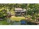 Aerial view of home's backyard with a large wooden deck and porch leading to the water at 409 W Holding St, Smithfield, NC 27577