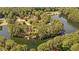 Aerial view of a lake community showcasing lush tree cover and waterfront properties at 409 W Holding St, Smithfield, NC 27577