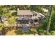 Aerial view of home and backyard featuring large deck, screened porch, and second-story balcony at 409 W Holding St, Smithfield, NC 27577