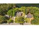 Aerial view outlining property lines with mature trees, a long driveway, and a well-maintained lawn at 409 W Holding St, Smithfield, NC 27577