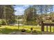 Scenic backyard featuring a lake view, flowers, and lush green space at 409 W Holding St, Smithfield, NC 27577