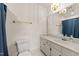 Well-maintained bathroom with a vanity, mirror, and a classic design at 409 W Holding St, Smithfield, NC 27577