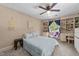 Cozy bedroom with neutral walls, carpet, built-in shelving and a ceiling fan at 409 W Holding St, Smithfield, NC 27577