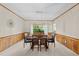 Elegant dining room with modern lighting and wainscoting at 409 W Holding St, Smithfield, NC 27577