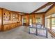 Bright, spacious living area featuring wood accents and built-in storage, offering backyard views at 409 W Holding St, Smithfield, NC 27577