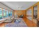 Bright and cozy living room with hardwood floors and large windows at 409 W Holding St, Smithfield, NC 27577