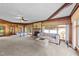 Spacious living room featuring a stone fireplace, large windows and comfortable seating, perfect for relaxation at 409 W Holding St, Smithfield, NC 27577
