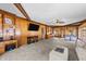 Large living room with wood accents, offering ample space, built-in shelving, and backyard views at 409 W Holding St, Smithfield, NC 27577