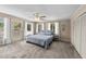 Comfortable main bedroom with private balcony, ceiling fan, ensuite bathroom, and neutral decor at 409 W Holding St, Smithfield, NC 27577
