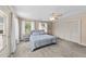 Tranquil main bedroom featuring a private balcony, ceiling fan, closet, and backyard views at 409 W Holding St, Smithfield, NC 27577