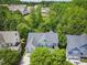 Aerial view of home showcasing the well-maintained roof and verdant surroundings at 415 Waverly Hills Dr, Cary, NC 27519