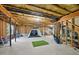 Unfinished basement with a golf simulator for recreation and leisure at 415 Waverly Hills Dr, Cary, NC 27519