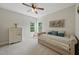 Cozy bedroom with a daybed, light dresser, and natural light streaming through the windows at 415 Waverly Hills Dr, Cary, NC 27519