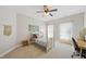 Charming bedroom with a four-poster bed, desk, and windows with bright natural light at 415 Waverly Hills Dr, Cary, NC 27519