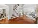 Bright foyer features hardwood floors, staircase, and ample natural light at 415 Waverly Hills Dr, Cary, NC 27519