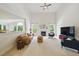 Spacious living room with a fireplace, high ceilings, and abundant natural light at 415 Waverly Hills Dr, Cary, NC 27519