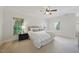 Light and airy main bedroom featuring neutral tones, plush bedding, and natural light from the windows at 415 Waverly Hills Dr, Cary, NC 27519