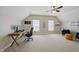 Spacious home office with vaulted ceilings, desk, and seating area at 415 Waverly Hills Dr, Cary, NC 27519
