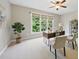 Bright office featuring a large window with green view, modern desk, and neutral decor at 415 Waverly Hills Dr, Cary, NC 27519