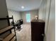 This bedroom is carpeted, and exercise equipment and shelving provide for both rest and activity at 420 Spring Ln, Henderson, NC 27537