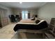 Bedroom featuring neutral walls, carpeted floors, a bed and a work space at 420 Spring Ln, Henderson, NC 27537