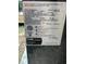 Equipment data plate shows the model and serial numbers of the air conditioner at 420 Spring Ln, Henderson, NC 27537