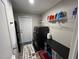The laundry room includes a washer and dryer, shelves with cleaning supplies, and an exterior door at 420 Spring Ln, Henderson, NC 27537