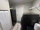 The laundry area includes a washing machine, refrigerator, and exterior door for convenience at 420 Spring Ln, Henderson, NC 27537