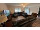 Spacious living room with a sectional, comfortable recliners and plenty of seating at 420 Spring Ln, Henderson, NC 27537